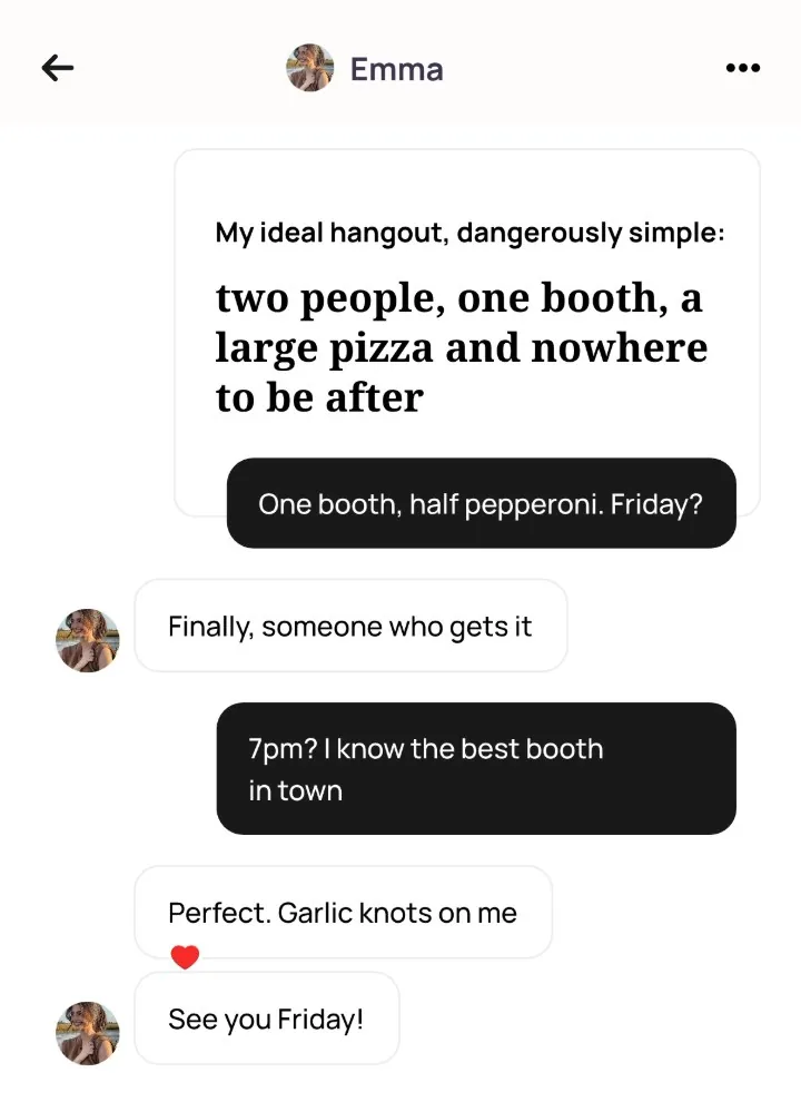 An Alyke chat with Emma that opens on her prompt and that comment, then: Finally, someone who gets it. 7pm? I know the best booth in town. Perfect. Garlic knots on me. See you Friday!