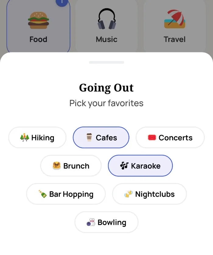 The Alyke interest picker open on the Going Out category, with Cafes and Karaoke selected and Hiking, Concerts, Brunch, Bar Hopping, Nightclubs and Bowling left unselected