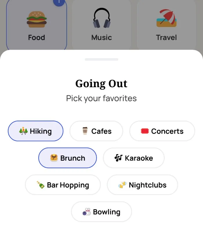 Alyke's interest picker open on the Going Out category, with Hiking and Brunch selected and Cafes, Concerts, Karaoke, Bar Hopping, Nightclubs and Bowling unselected