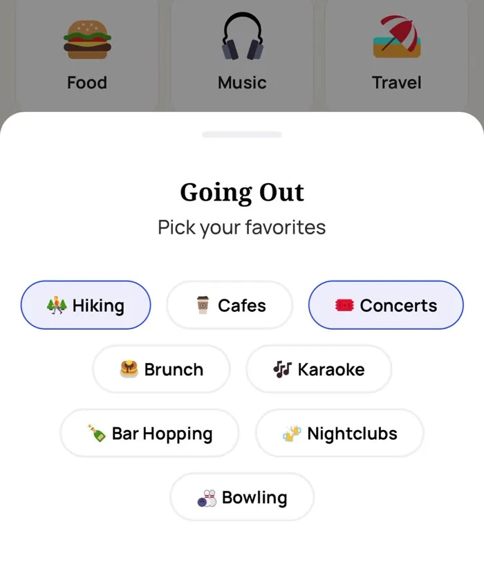 The Alyke interest picker open on the Going Out category, with Hiking and Concerts selected