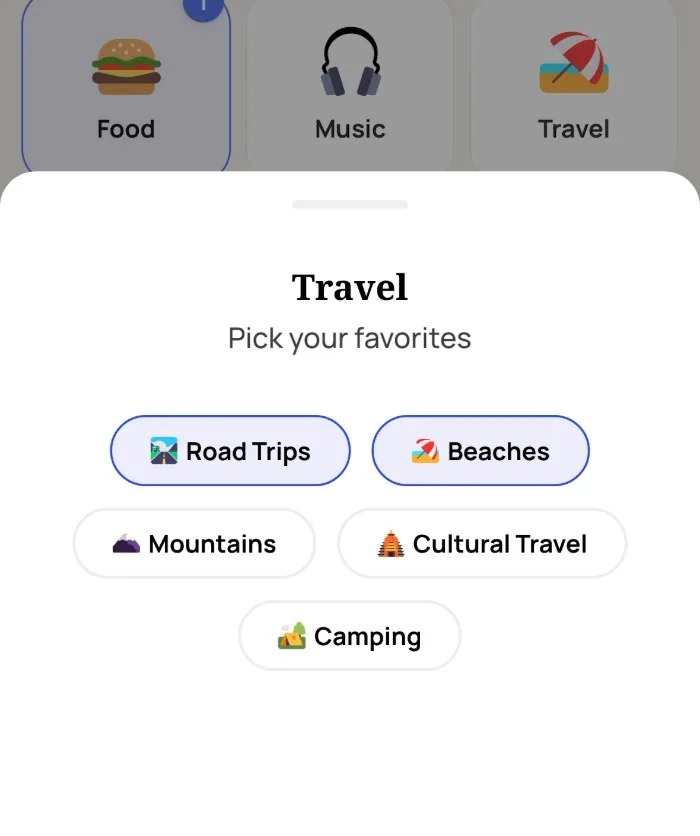 Alyke's interest picker open on the Travel category, with Road Trips and Beaches selected and Mountains, Cultural Travel and Camping left unselected