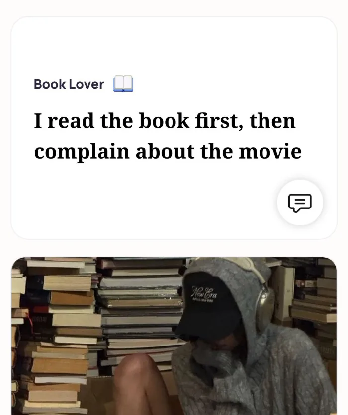 An Alyke profile card for Book Lover that reads: I read the book first, then complain about the movie, above a photo of someone in a hoodie and cap sitting among stacks of books