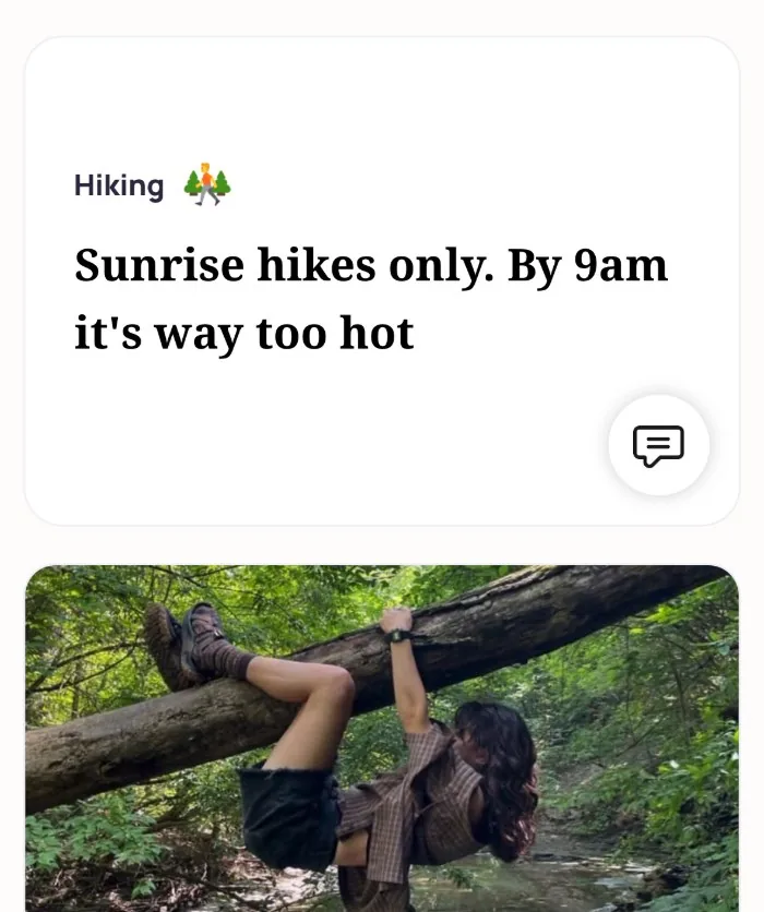 An Alyke profile card for Hiking that reads: Sunrise hikes only. By 9am it's way too hot, above a photo of someone hanging upside down from a fallen tree over a creek