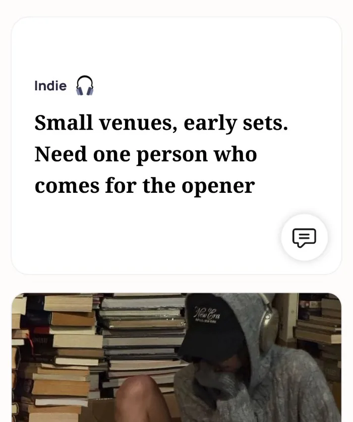 An Alyke profile card for Indie that reads: Small venues, early sets. Need one person who comes for the opener, above a photo of the member in a gray hoodie, cap and headphones among stacks of books