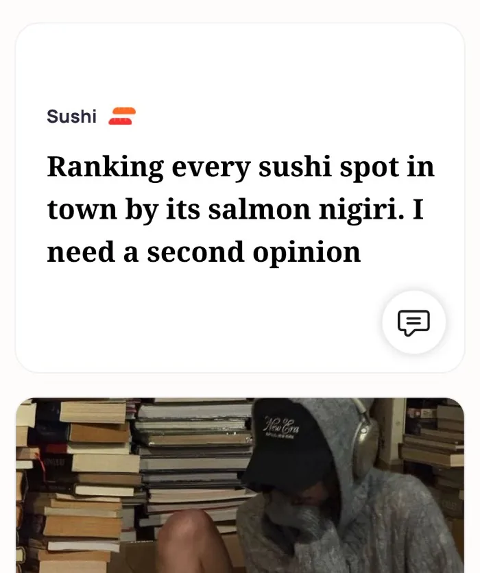 Emma's Alyke profile with her Sushi interest card reading: Ranking every sushi spot in town by its salmon nigiri. I need a second opinion, above her photo in a hoodie and cap among stacks of books