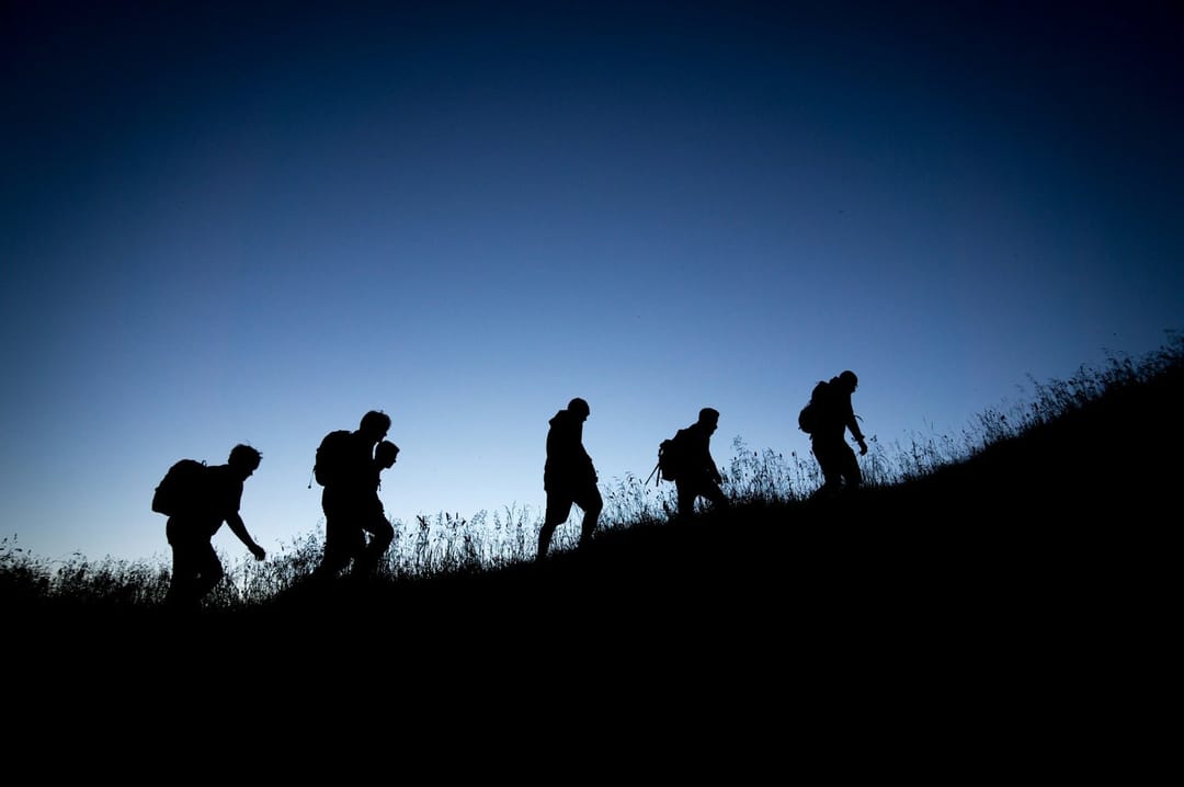 Hikers talking on a Griffith Park trail at dusk