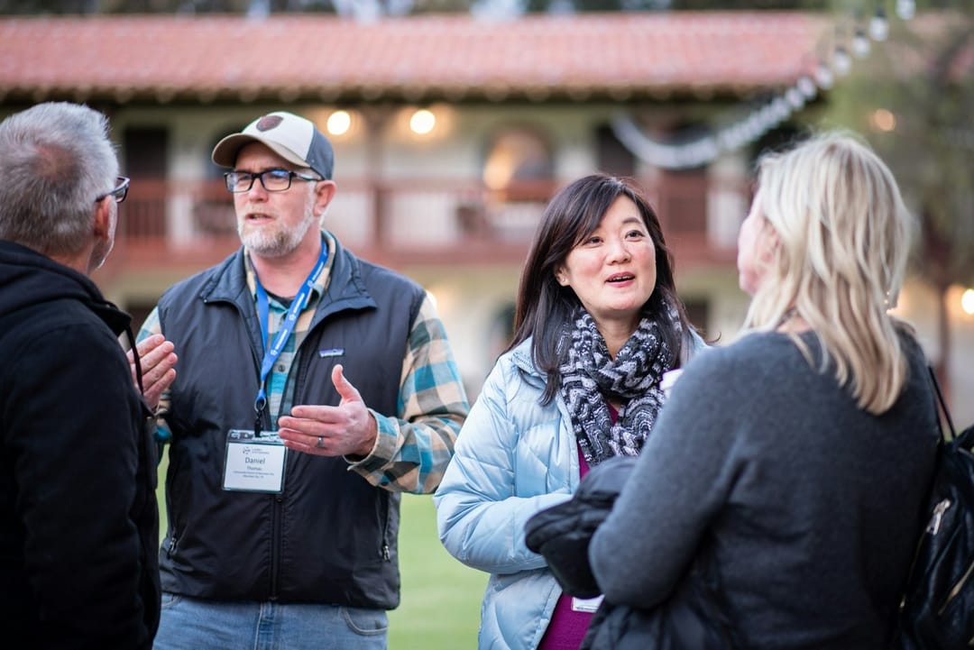New members talking at an outdoor club's welcome night