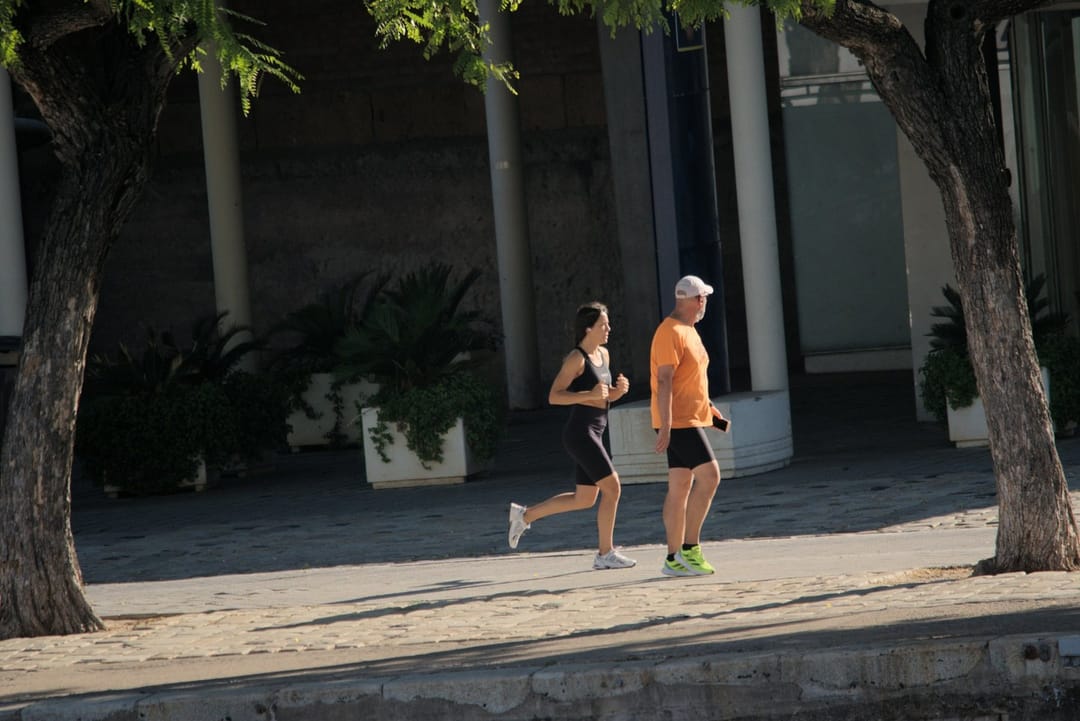 Runners talking on an early morning run
