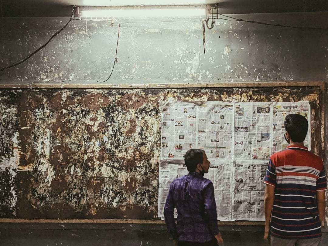 Two people talking by a film poster after a screening
