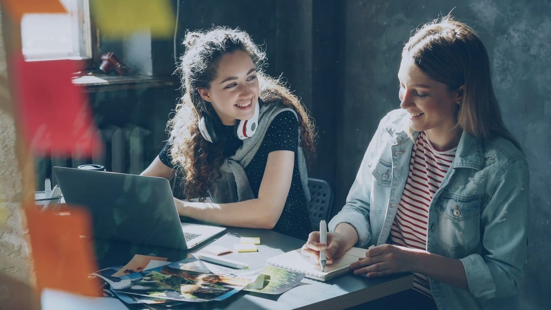 Two students laughing in an evening language class